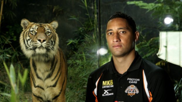 Big cats ... Tiger-for-life Benji Marshall poses with the real thing at Taronga Zoo yesterday. He says he opted to keep a lid on his decision to re-sign.