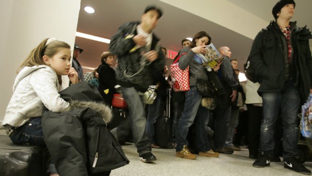 Flights grounded ... passengers wait to be rescreened at an airport in Newark, New Jersey, after a security scare.
