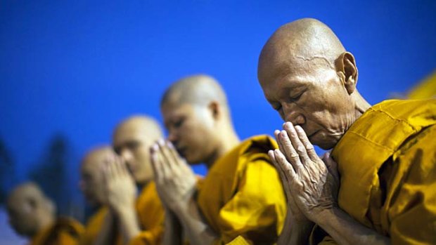 A basic rule in Thailand (as well as in Burma and Sri Lanka): women don't touch monks.