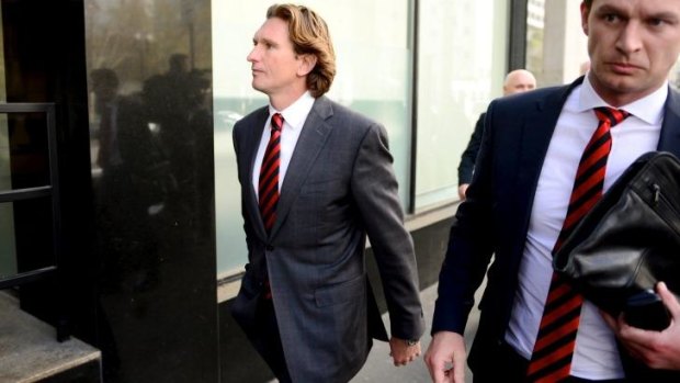 James Hird leaves the court on Friday after the ruling went against him and the club.