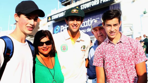 Ashton Agar of Australia is congatulated by his parents John and Sonia and brothers Wesley and William in Nottingham.