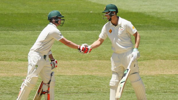 Adam Voges (right) celebrates 1000 runs in a calendar year with Steve Smith.