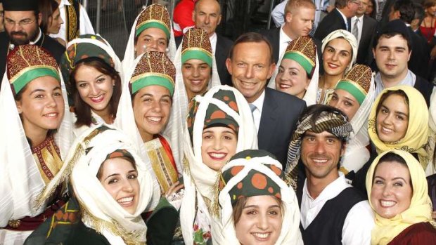Prime Minister Tony Abbott with greek dancers at the Antipodes Festival on Lonsdale Street.