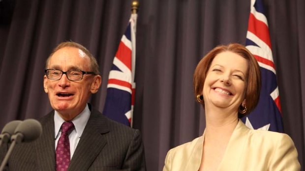 Smug success... Julia Gillard with Bob Carr.