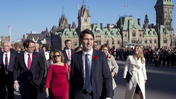 Prime Minister Justin Trudeau and his newly sworn-in cabinet ministers arrive on Parliament Hill in Ottawa.