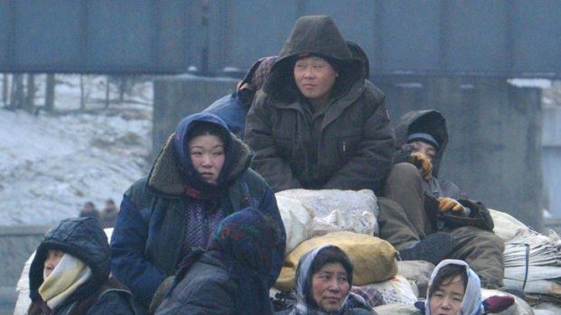 Frozen out ... North Koreans wait in a truck in  Pyongyang.