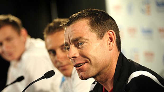 Cadel Evans (right) fronts the media on the weekend.