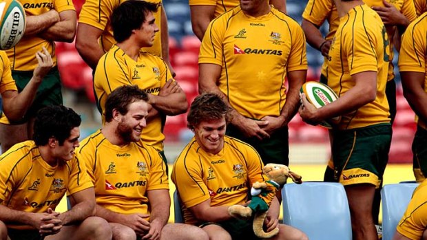 Shot at redemption ... the Wallabies attend a photo opportunity before tonight's Test in Newcastle where rain and gale-force winds are forecast for the match against Scotland.