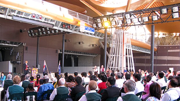 More than 50 people become citizens in an Australia Day ceremony at the entrance to the new Clem7 tunnel at Bowen Hills.