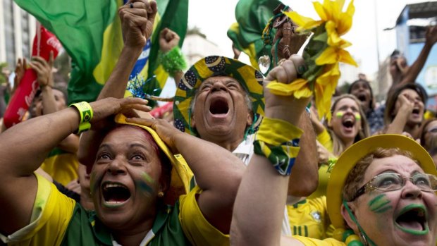 Pent-up emotion: Brazil fans celebrate a goal in the penalty shootout.