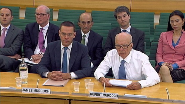 James (L) and Rupert Murdoch are questioned by the British parliamentary committee.