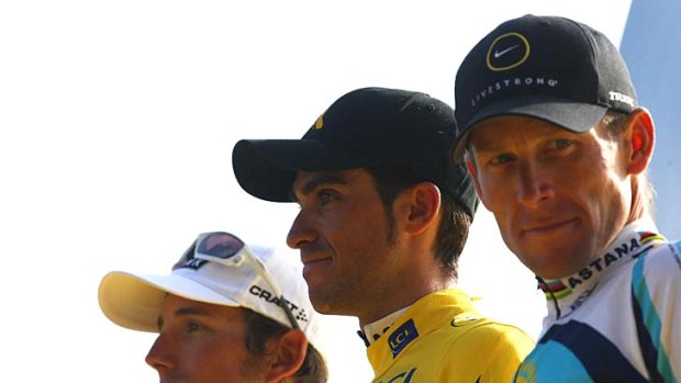 The winner of the 2009 Tour de France Alberto Contador (centre), second-placed Andy Schleck (left), and third-placed Lance Armstrong.