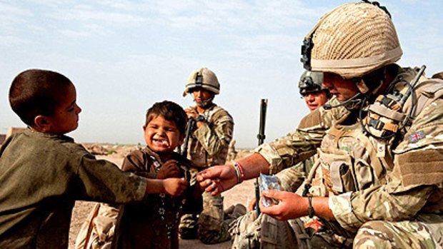 British soldiers meet children in Lashkar Gah, the capital of Afghanistan's Helmand province.
