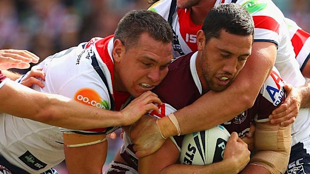 Brent Kite of the Sea Eagles is tackled.