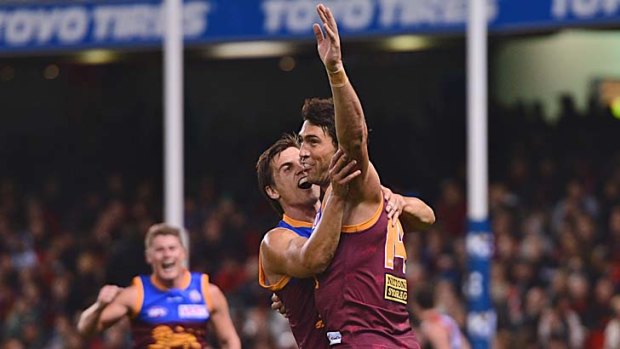 Brent Staker celebrates after kicking the winning goal for Brisbane against Essendon in round eight, a difficult set shot from near the boundary line of Etihad Stadium.