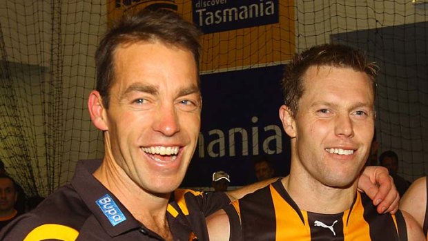 Winners are grinners: Alastair Clarkson and Sam Mitchell after the Hawks' win over Essendon last week.