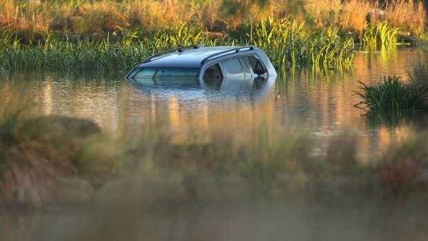 Akon Guode's car in the lake where three of her children died in April 2015.