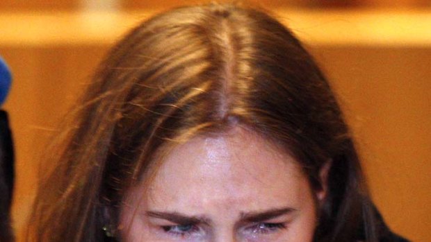 Tears of joy ... Amanda Knox reacts as she listens to the verdict.