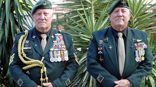 Twins John and George Hines, 68, at the 2012 ANZAC Day parade in Brisbane.