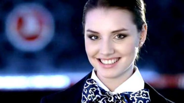 A Turkish Airlines flight attendant. Chief Executive Temel Kotil said a ban on flight attendants wearing red lipstick and nail polish has been scrapped and was made by 'overzealous junior managers'.