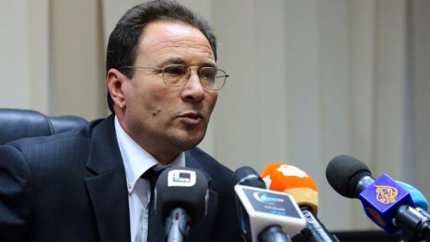 Survived: Libyan Deputy Prime Minister Al-Siddiq Karim speaks to the media after an attempt on his life in Tripoli.