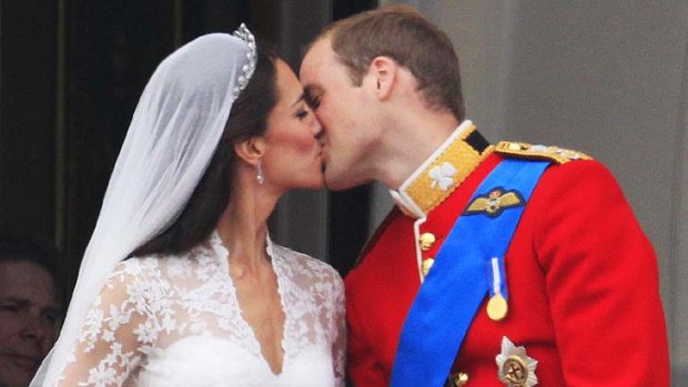 Happily married ... Prince William and Kate Middleton watched their own wedding on TV after kissing for the billions of people watching.
