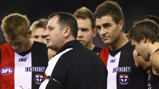 Ross Lyon talks to his players during their match against West Coast.