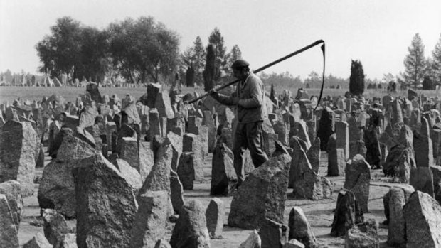 Lest we forget: A worker walks among the memorial's 17,000 stones in 1990.