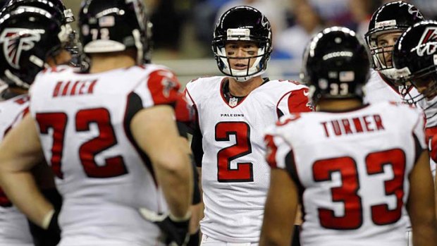 Atlanta Falcons quarterback Matt Ryan (2) talks to his teammates in the huddle during the second half of the game against the Detroit Lions.