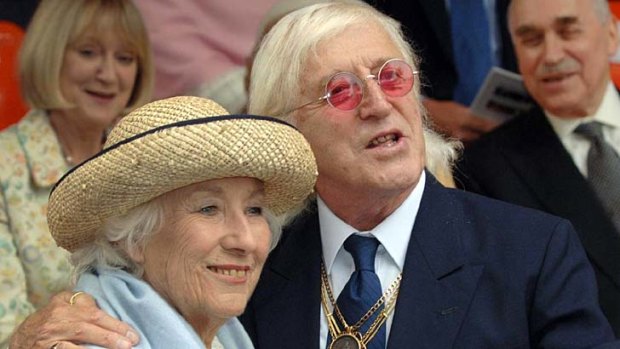 Accused of preying on girls and women ... Jimmy Savile British with singer Vera Lynn.