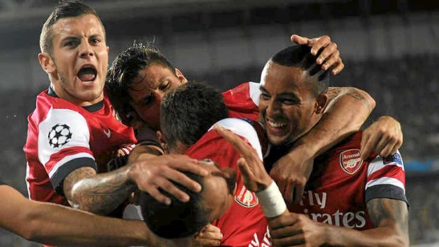 Relief: Arsenal celebrate against after Kieran Gibbs scored against Fenerbahce.
