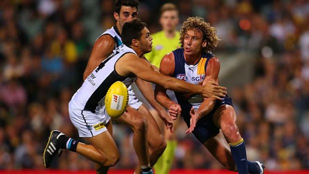Just in time: Eagle Matt Priddis fires off a handball during the loss to Port Adelaide.