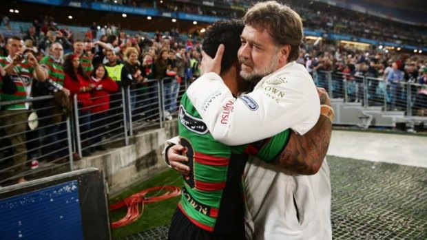 Russell Crowe embraces Issac Luke of the Rabbitohs after the first preliminary final between the Rabbitohs and the Roosters on Friday.
