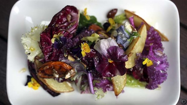 Seasonal roasted vegetables, mixed lettuce, goats curd, almonds, herbs, bread crumbs and olive oil.