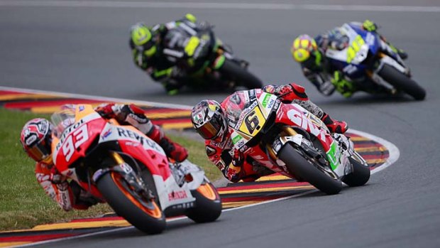 Marc Maquez is closely followed by Stefan Bradl of Germany, Valentino Rossi of Italy and Cal Crutchlow of Britain during the German MotoGP at Sachsenring on Sunday.