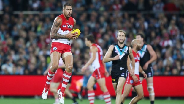 Lance Franklin is airborne as he takes a mark.