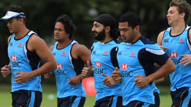 Unusual company &#8230; England cricketer Monty Panesar trains with the NSW Waratahs at the Sydney Football Stadium.