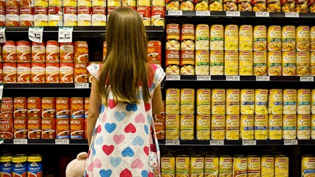 Supermarket giants Coles and Woolworths criticised by canner HJ Heinz for being hostile to suppliers.