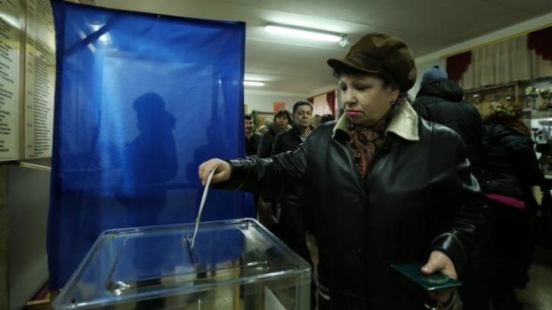 Keen to join Russia: Nadezhda Eleseeva casts the first vote at a polling station in Simferopol.