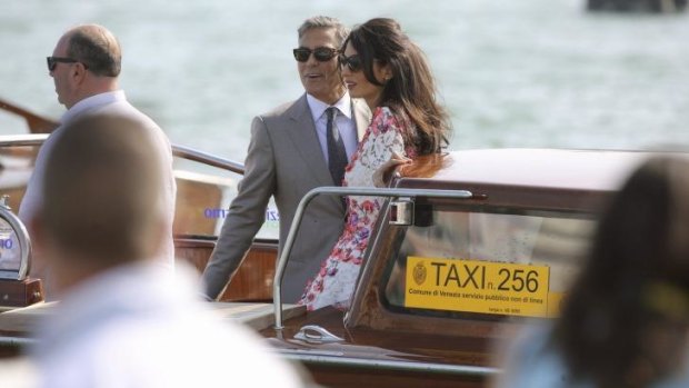 Newlyweds George Clooney and Amal Alamuddin took to the Grand Canal in Venice on Sunday.