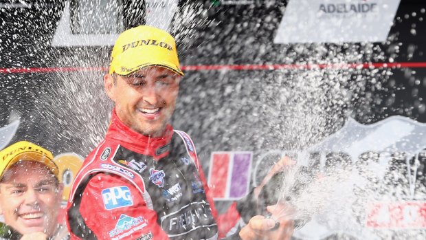 Holden driver Fabian Coulthard celebrates his win in this year's V8 Supercars' Adelaide street race.