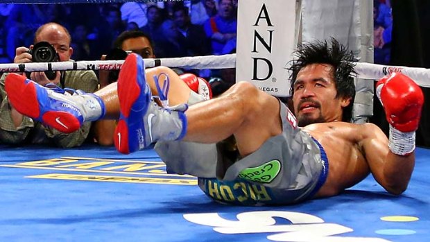 Manny Pacquiao hits the canvas in the third round.