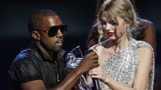 Oh no, he didn't: Kanye West takes the microphone from best female video winner Taylor Swift as he praises the video entry from Beyonce at the 2009 MTV Video Music Awards.