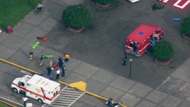 This image made from a video provided by KOMO shows emergency personnel responding after reports of a shooting at Marysville-Pilchuck High School in Marysville, Washington.