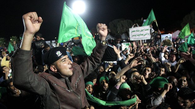Supporters of the Gaddafi regime at a staged Tripoli demonstration, in pictures taken on a trip organised by the Libyan authorities.