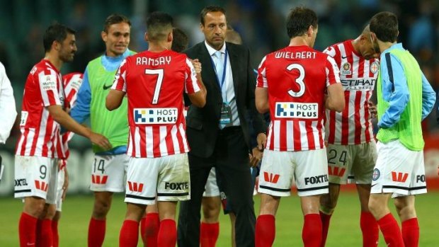 Well done, boys: Melbourne City coach John Van't Schip shakes hands with his players after the game.