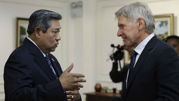 Living dangerously: Indonesian President Susilo Bambang Yudhoyono speaks to Harrison Ford at the presidential palace in Jakarta.