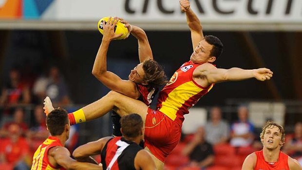 Joe Daniher of the Bombers marks strongly against the Gold Coast.