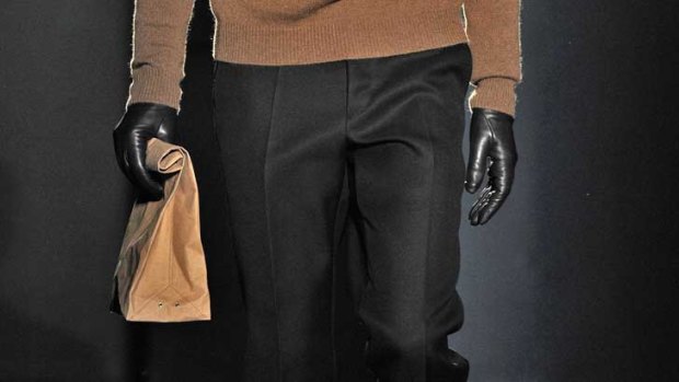 Jil Sander sent models down the a/w 2012 catwalk holding the designer loot.