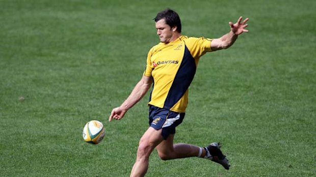 Adam Ashley-Cooper kicks the ball during the Wallabies Captain's Run at Suncorp Stadium yesterday.